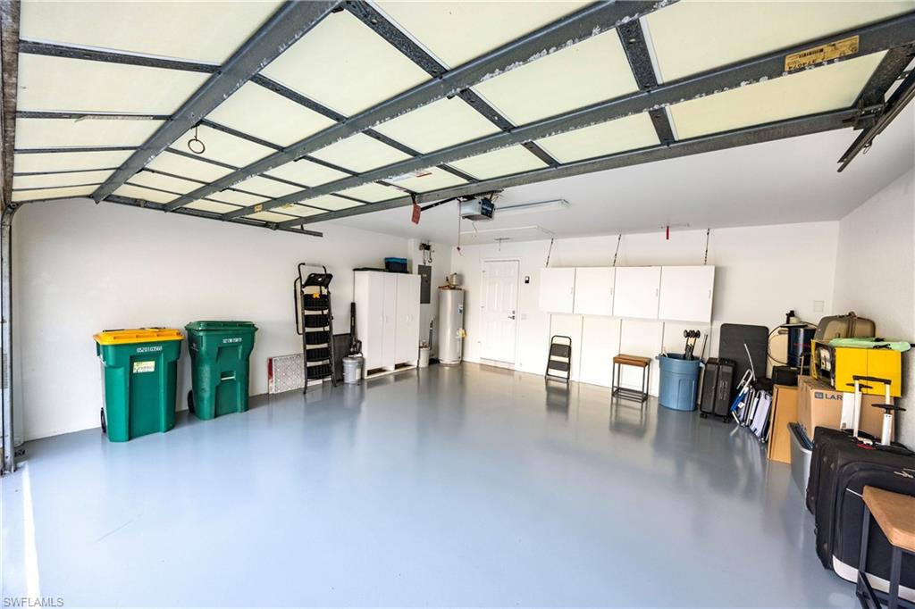 4708 Rio Poco Court Naples, FL 34109 - Photo 36 of 37 Garage featuring water heater