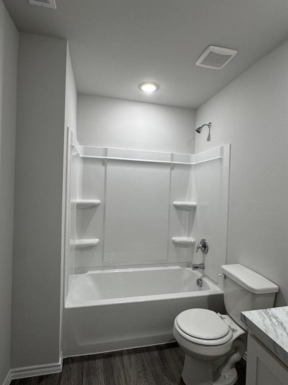 350 Azalea Trail Granbury, TX 76048 - Photo 12 of 18 a bathroom with a toilet and a bathtub