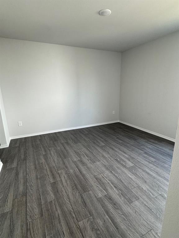 350 Azalea Trail Granbury, TX 76048 - Photo 15 of 18 a view of room with wooden floor