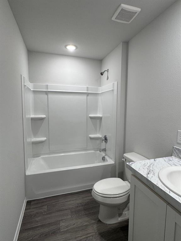 350 Azalea Trail Granbury, TX 76048 - Photo 16 of 18 a bathroom with a sink a toilet and shower