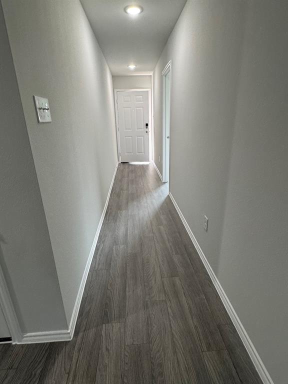 350 Azalea Trail Granbury, TX 76048 - Photo 4 of 18 a view of a hallway with wooden floor