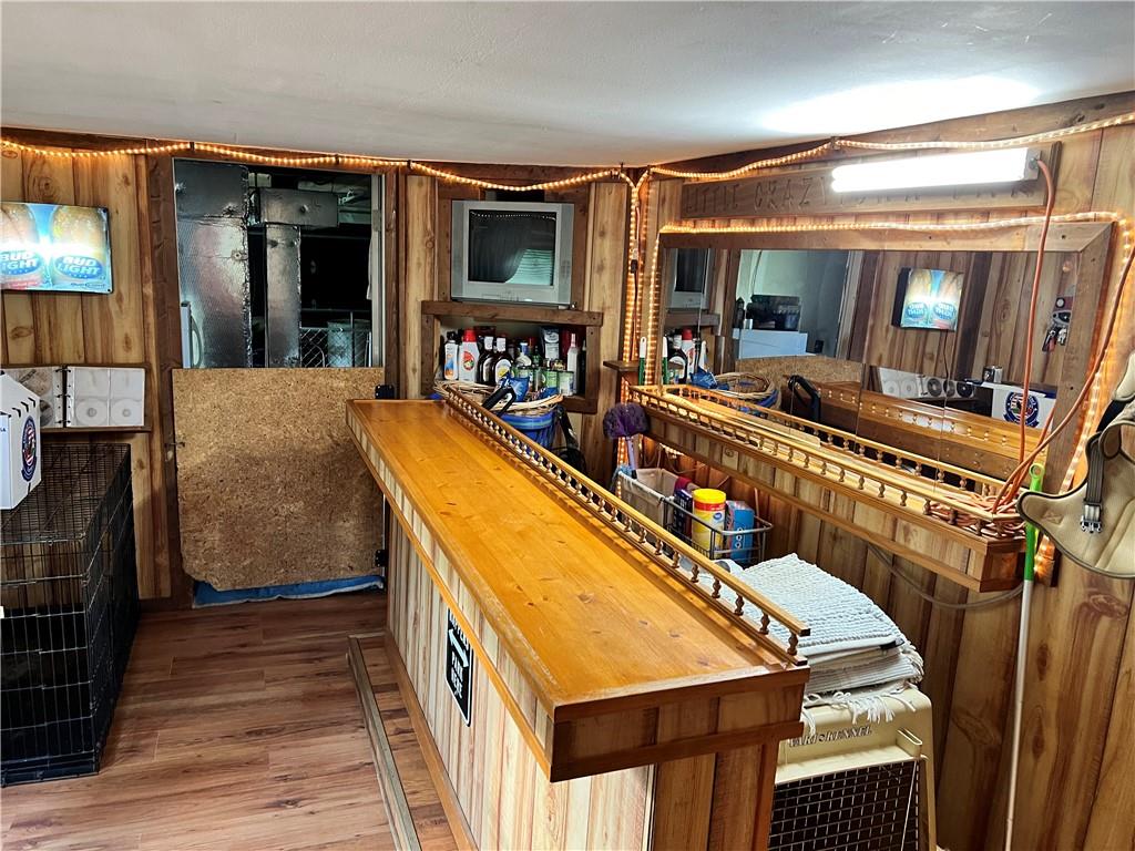 6390 Mercer Road Polk, PA 16342 - Photo 5 of 22 a room with wooden floor and furniture