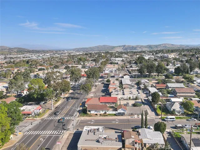 an aerial view of residential houses with city view