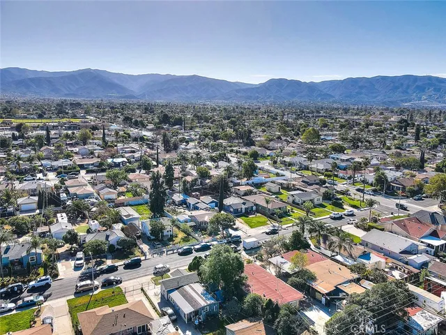 a view of a city with mountains in the background