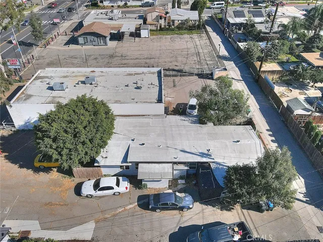 an aerial view of a house with garden space and sitting space