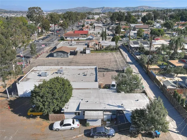 an aerial view of residential houses with outdoor space