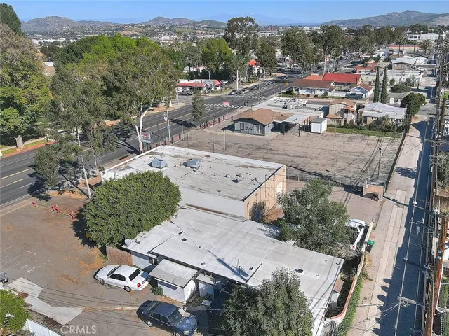 an aerial view of a houses with a yard