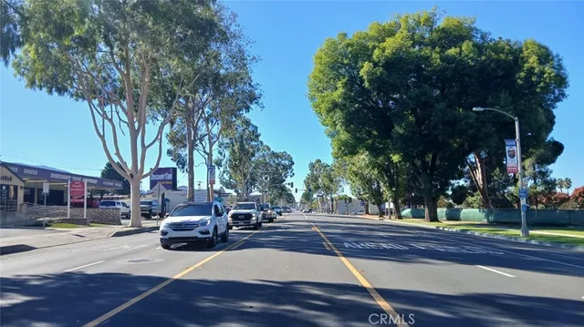 a view of street with parked cars
