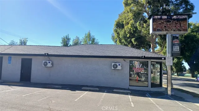 a front view of a house with parking area