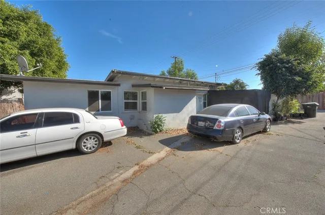 a view of a car parked in front of a house
