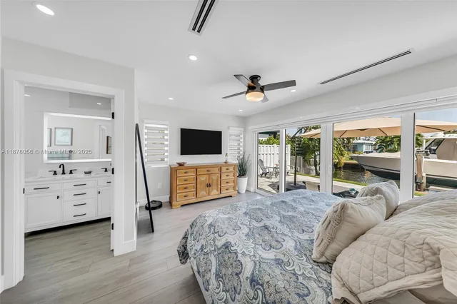 a living room with lots of furniture and kitchen view