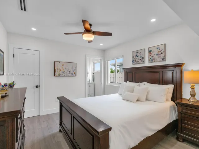 a living room with furniture kitchen view and a table