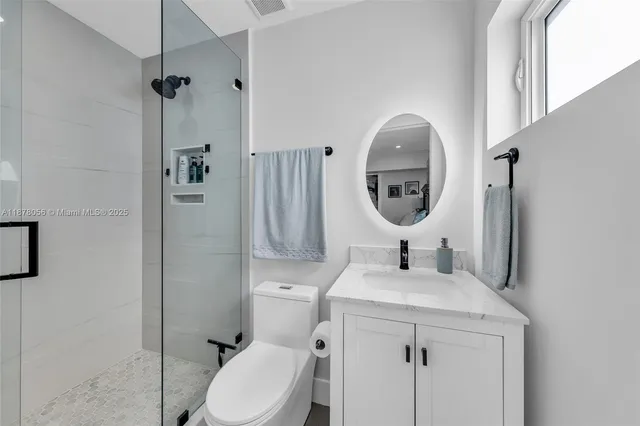 a living room with furniture kitchen view and a table