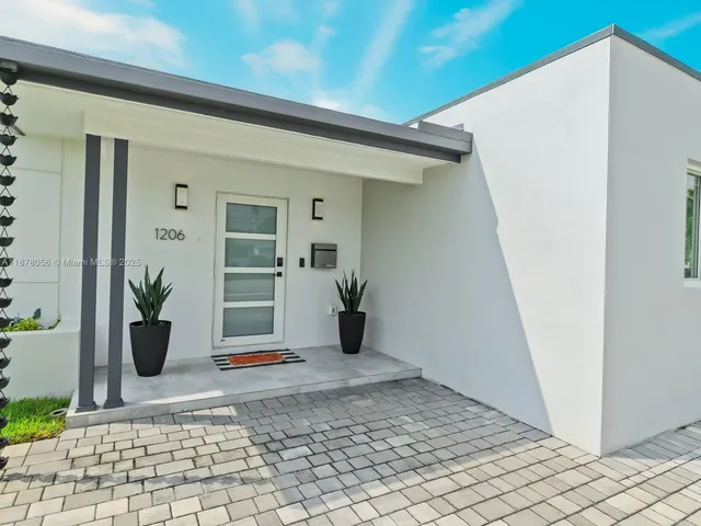 a kitchen with stainless steel appliances kitchen island a large island in the center