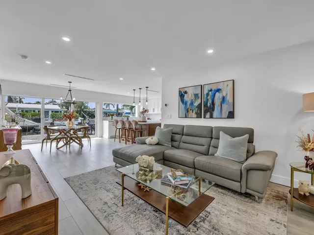 a kitchen with stainless steel appliances a stove a sink and a refrigerator