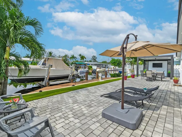 a front view of a house with a garden and yard