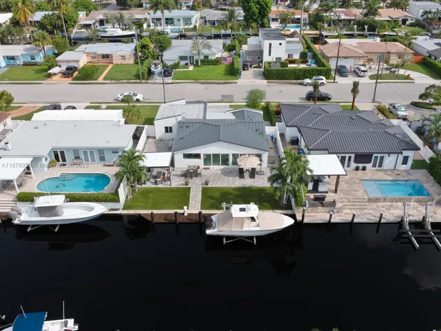 a view of house with yard and staircase