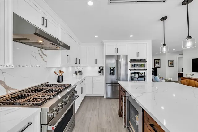 a view of a patio with table and chairs