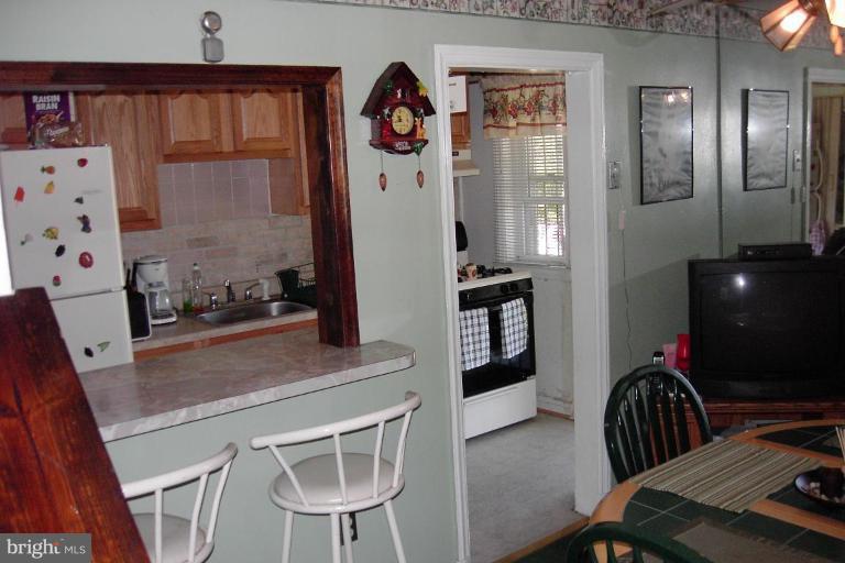 2526 Riggs Avenue Baltimore, MD 21216 - Photo 11 of 23 View of Breakfast Bar and Kitchen From Dining Room