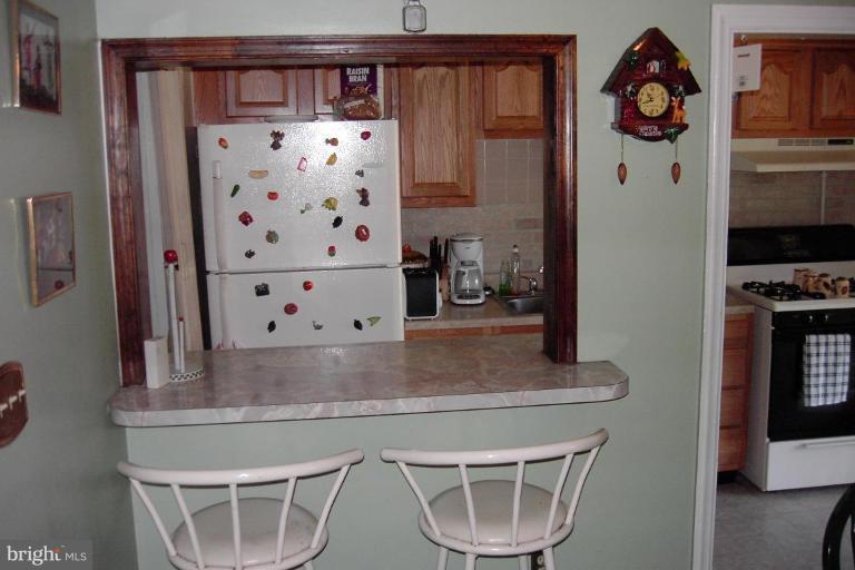 2526 Riggs Avenue Baltimore, MD 21216 - Photo 12 of 23 Pass-Through Between Kitchen and Dining Room