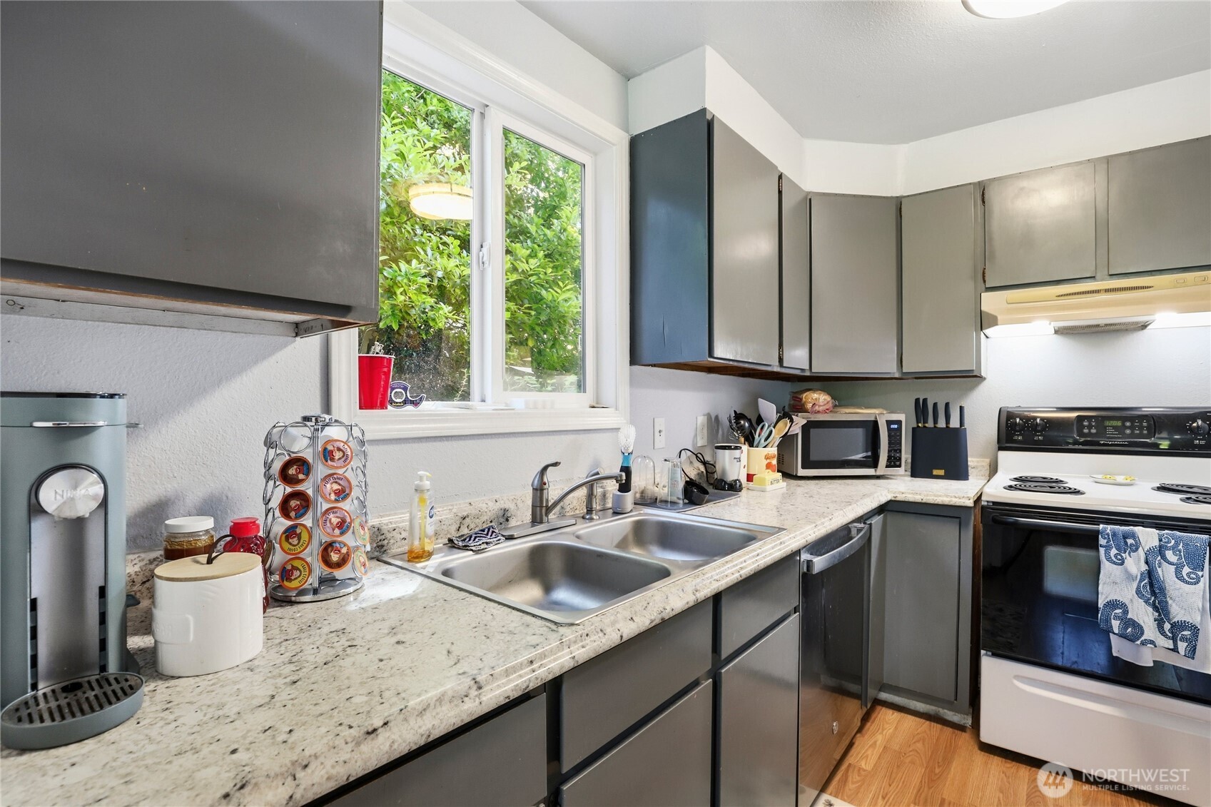 2533 Fir Avenue Bremerton, WA 98310 - Photo 11 of 38 a kitchen with a sink cabinets and window