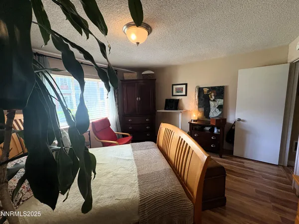 a bedroom with furniture and a window