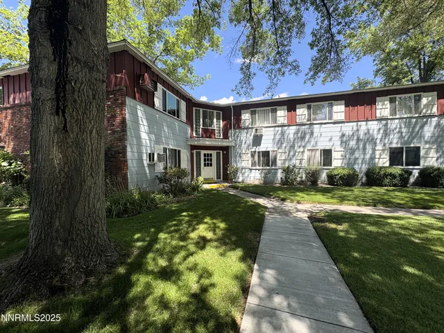 a view of a house with a backyard