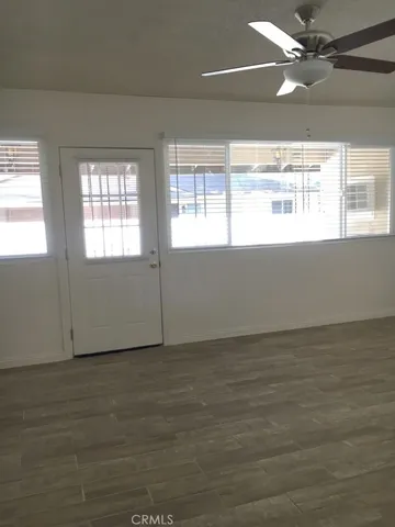 a view of an empty room and window