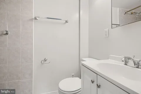 a bathroom with a sink toilet and vanity