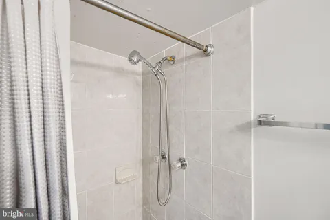 a bathroom with a glass shower door