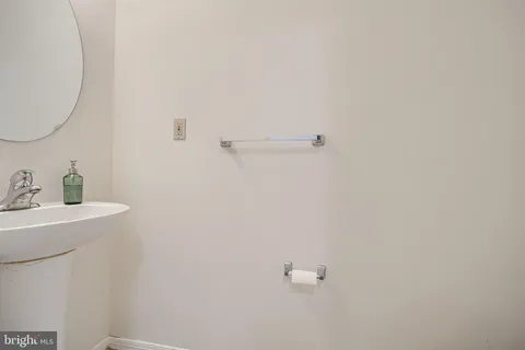 a bathroom with a sink a mirror and vanity
