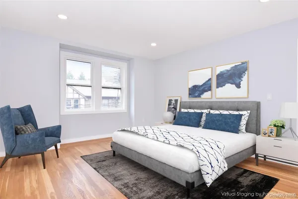 a kitchen with stainless steel appliances white cabinets and a stove top oven