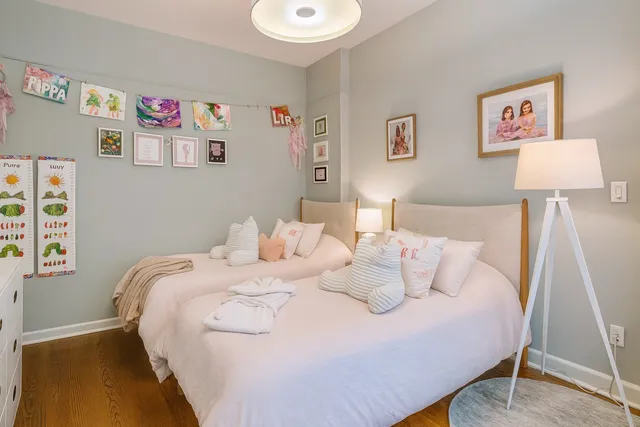 a bedroom with a bed and a dresser