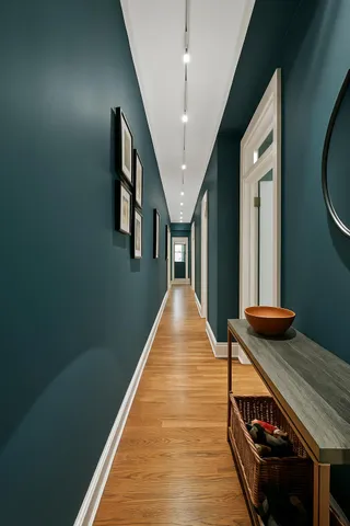 a bedroom with a bed and a lamp on table