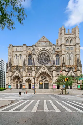 a sign board with yard in the back