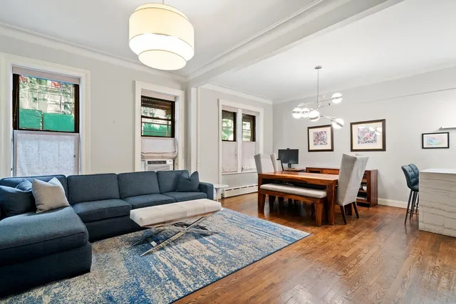 a kitchen with stainless steel appliances granite countertop a refrigerator a stove and a sink