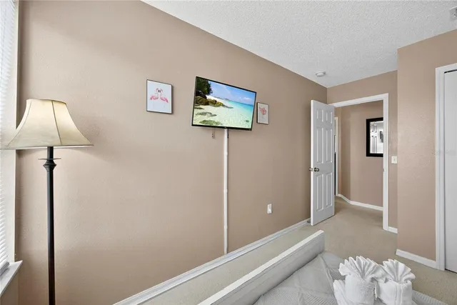a view of a room with wooden floor and cabinet