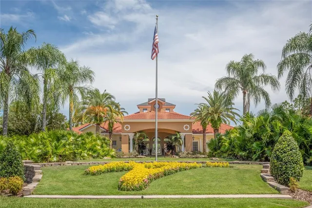 a view of a swimming pool with a garden and plants