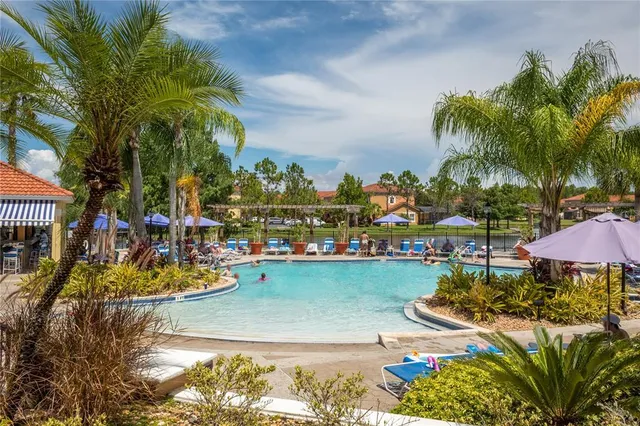 a living room with furniture ceiling fan and a window