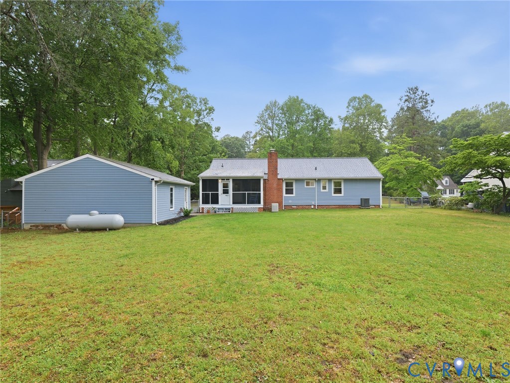 7707 Woodbrook Road Quinton, VA 23141 - Photo 41 of 42 Expansive backyard featuring a detached outbuildin