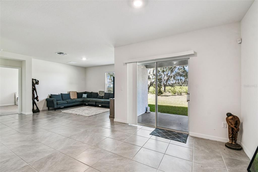 33635 Field Maple Loop Wesley Chapel, FL 33545 - Photo 17 of 35 a view of a living room filled with furniture