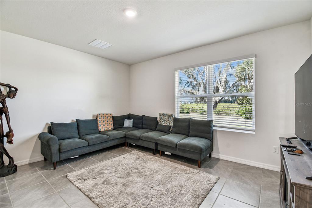 33635 Field Maple Loop Wesley Chapel, FL 33545 - Photo 18 of 35 a living room with furniture and a window