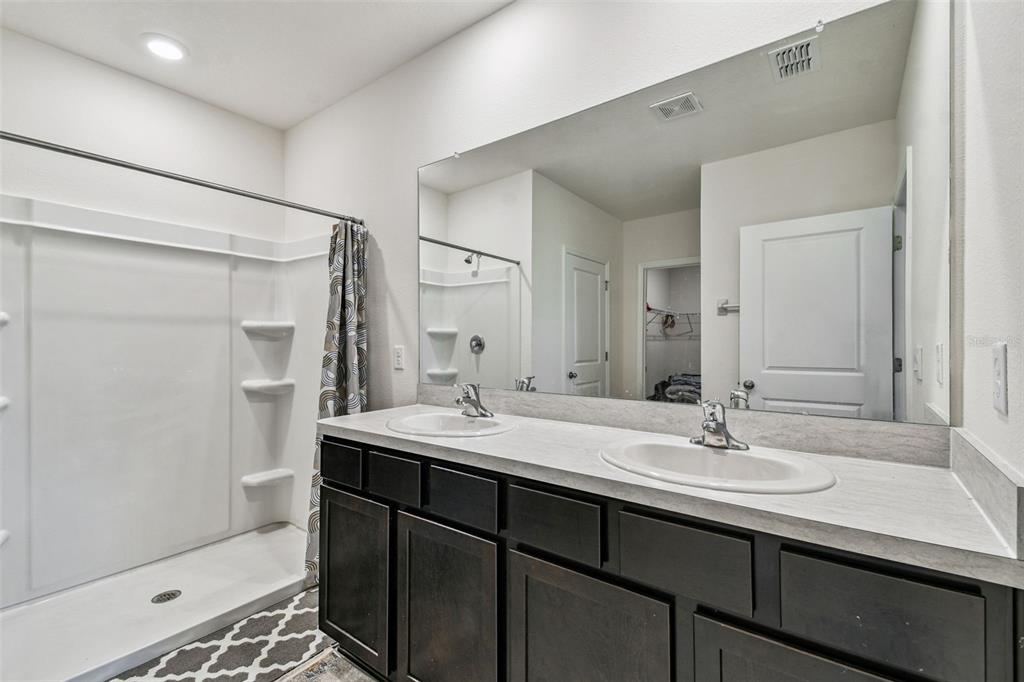 33635 Field Maple Loop Wesley Chapel, FL 33545 - Photo 24 of 35 a bathroom with a sink double vanity and a mirror