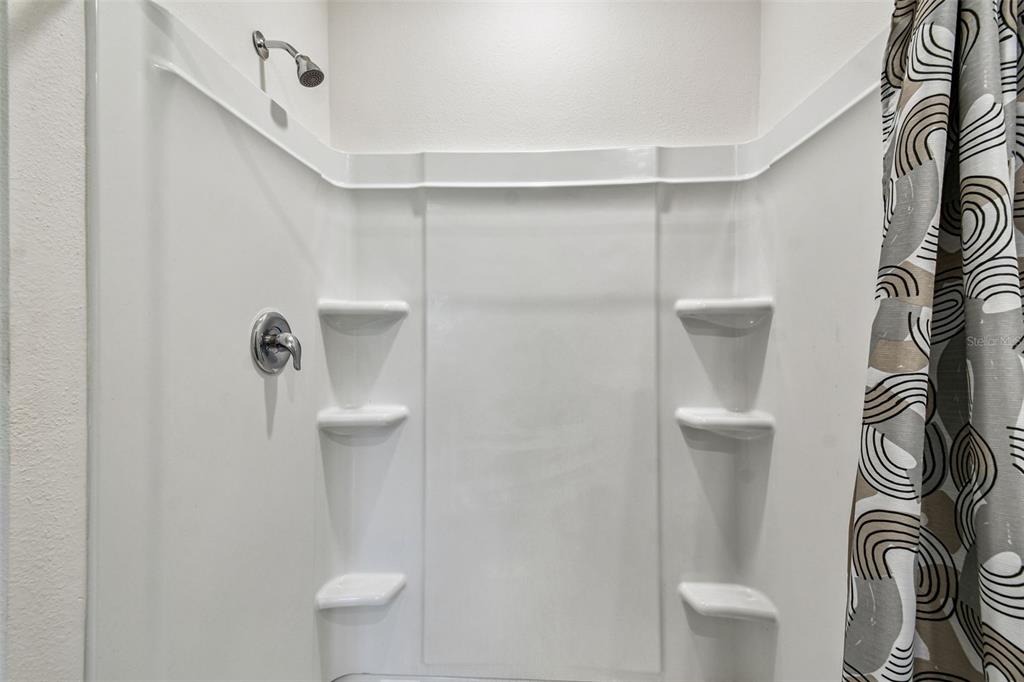 33635 Field Maple Loop Wesley Chapel, FL 33545 - Photo 26 of 35 a bathroom with a sink a toilet and shower