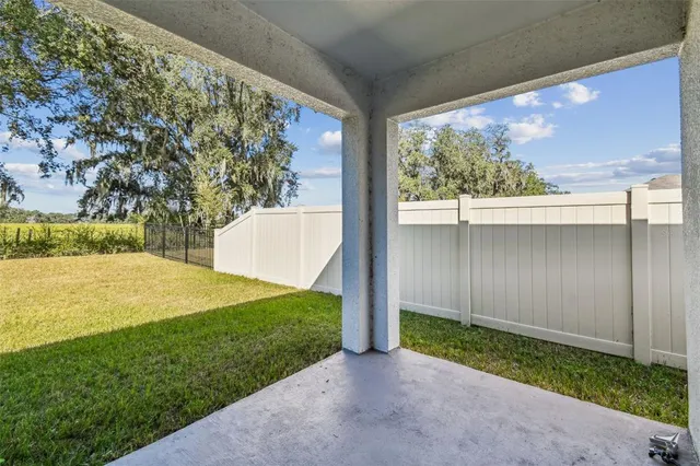 a view of yard and swimming pool