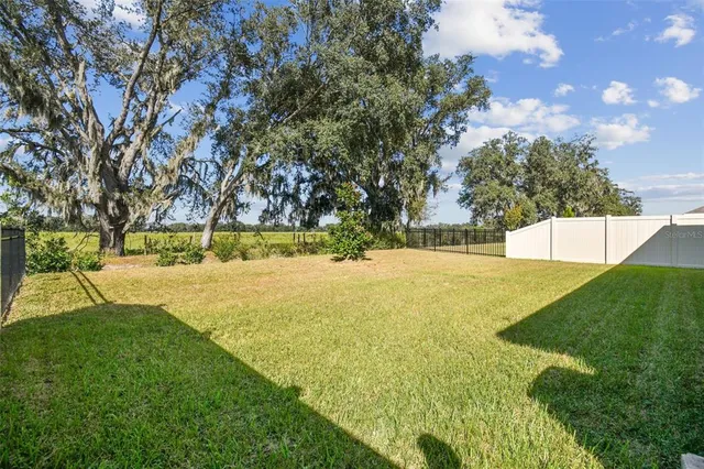 an aerial view of houses with outdoor space