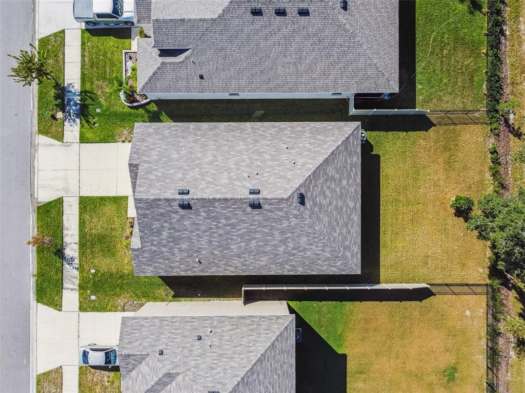 33635 Field Maple Loop Wesley Chapel, FL 33545 - Photo 31 of 35 an aerial view of houses with outdoor space