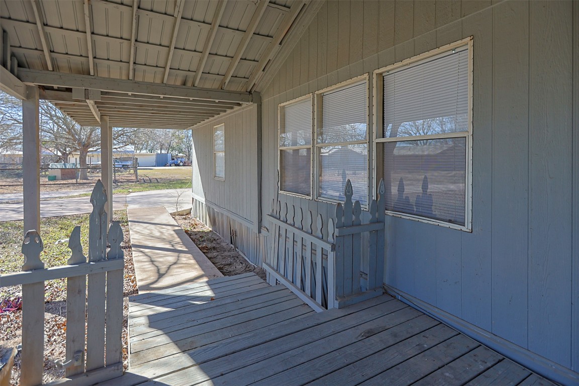 1403 Harris Hill Road San Marcos, TX 78666 - Photo 13 of 13 a view of a porch with wooden floor and outdoor space