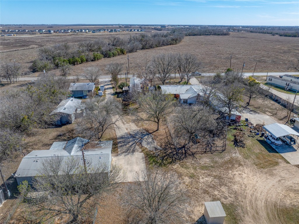 1403 Harris Hill Road San Marcos, TX 78666 - Photo 4 of 13 a view of a dry yard with trees