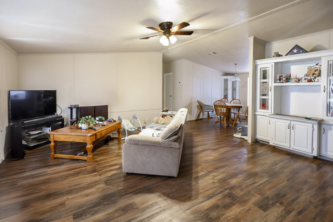1403 Harris Hill Road San Marcos, TX 78666 - Photo 8 of 13 a living room with furniture and a flat screen tv